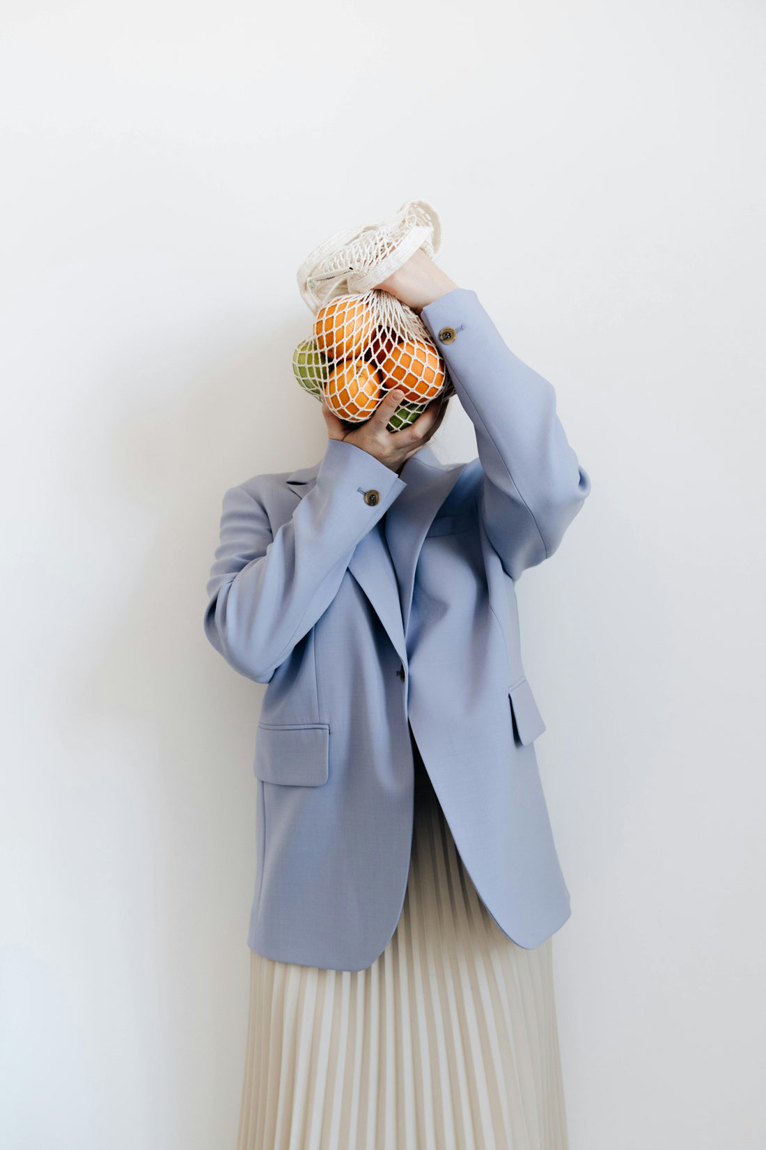 A Person with a fruit bag covering there face 